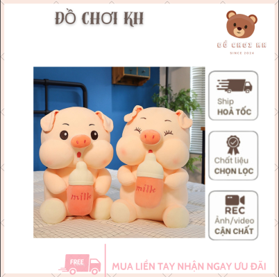 Hình ảnh chú heo ngồi uống sữa.